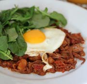 Hash with Fried Eggs, Sausage, and Arugula
